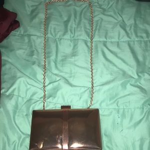 clutch/rose gold purse